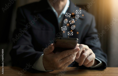Technology concept. Close up of businessman working on lsmart phone   sending email from smartphone for his business  marketing digital message electronic mail.
