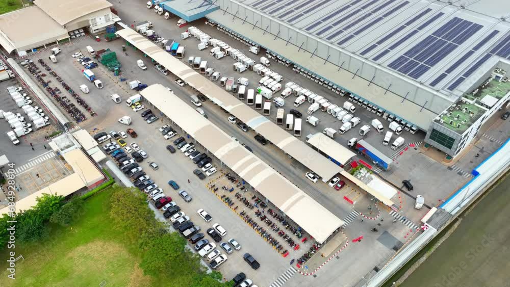 Industrial Efficiency: A drone's eye perspective reveals a bustling distribution center, where goods move seamlessly, resembling a well-oiled machine.
Industrial Efficiency: A drone's eye perspective reveals a bustling distribution center, where goods move seamlessly, resembling a well-oiled machine.