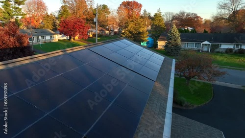 Wallpaper Mural Solar panels on American home. Aerial close up flyover of black array during autumn sunset. Torontodigital.ca