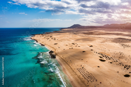 Aerial view of beach in Corralejo Park, Fuerteventura, Canary Islands. Corralejo Beach (Grandes Playas de Corralejo) on Fuerteventura, Canary Islands, Spain. Beautiful turquoise water and white sand.