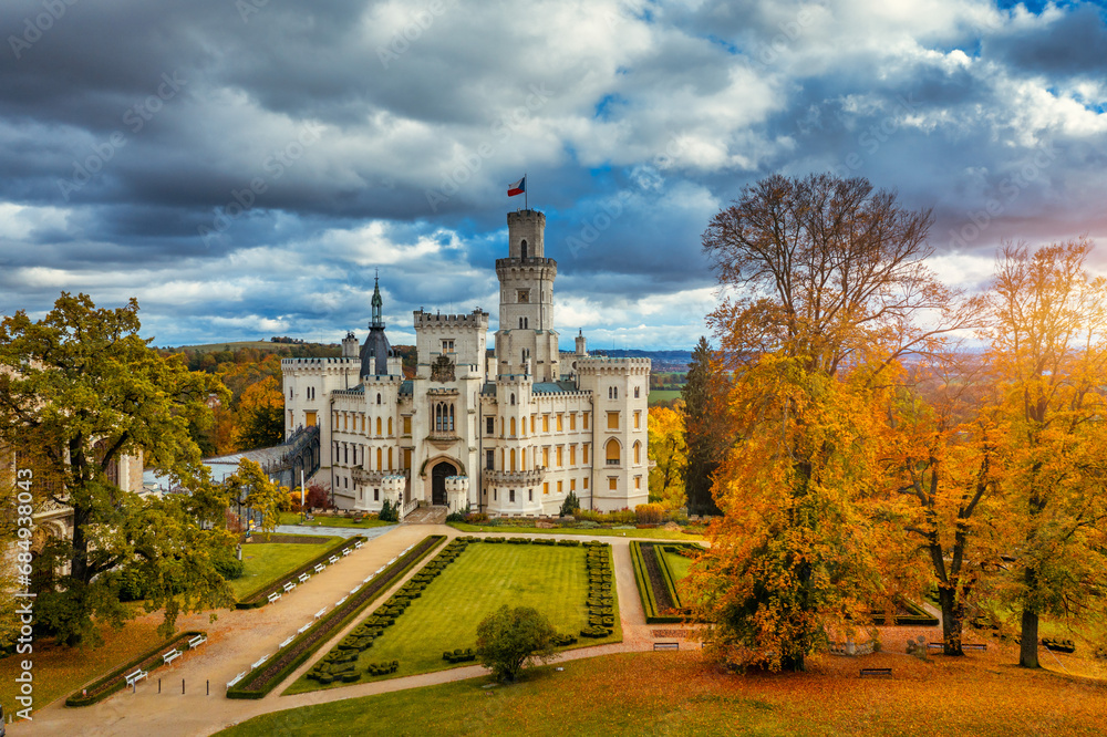 Obraz premium Castle Hluboka nad Vltavou is one of the most beautiful castles in Czech Republic. Castle Hluboka nad Vltavou in autumn with red foliage, Czechia. Colorful autumn view of Hluboka nad Vltavou castle.