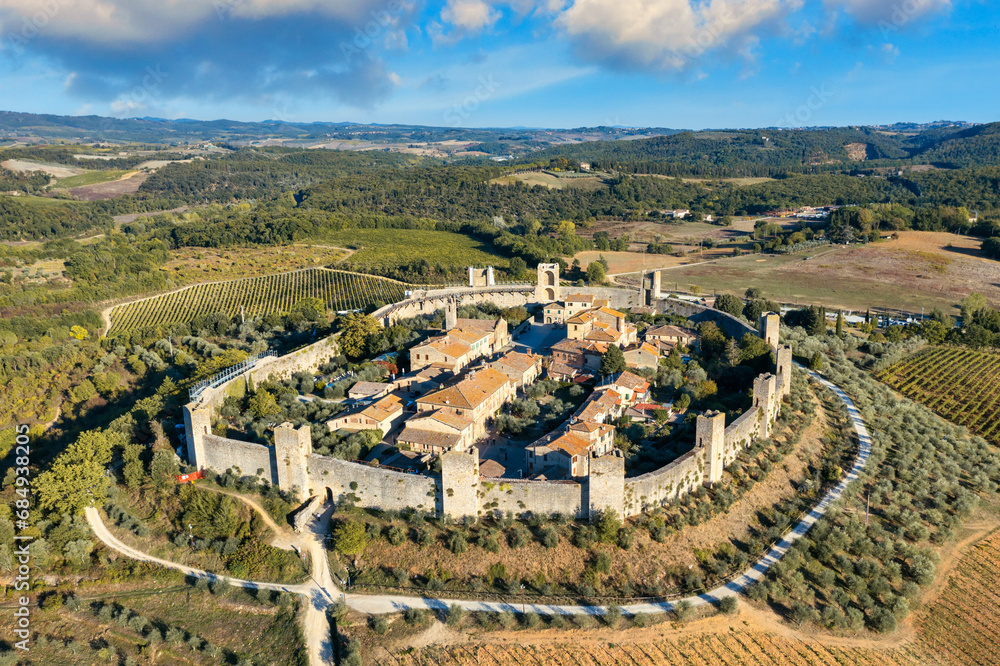 Beautiul aerial view of Monteriggioni, Tuscany medieval town on the hill. Tuscan scenic landscape vista with ancient walled city Monteriggioni, Italy.
