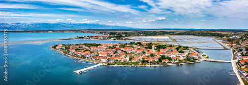 Historic town of Nin laguna aerial view with Velebit mountain background, Dalmatia region of Croatia. Aerial view of the famous Nin lagoon and medieval in Croatia