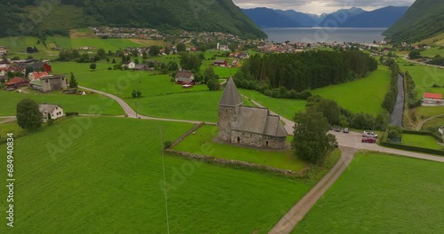 Historic Evangelical Stone Church Of Hove Steinkyrkje In Vestland County, Norway. Aerial Drone Shot photo