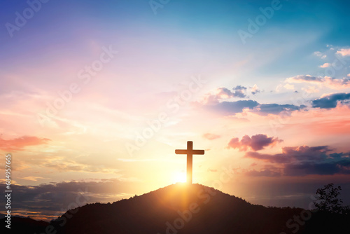Silhouette wooden cross on mountain sunset background