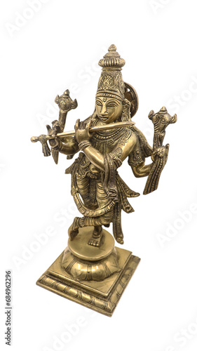 statue of hindu god lord krishna, a vishnu avatar, with multiple hands playing flute with hand signs crafted in gloden brass isolated in a white background
