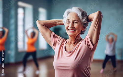 Elderly senior woman in stretching exercise class. Retirement and active living.