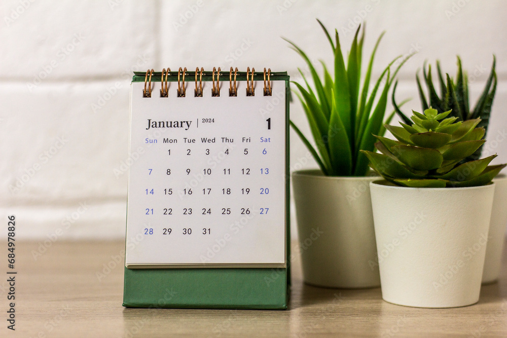 Hello January. Planning calendar for January 2024 on the desktop. - obrazy, fototapety, plakaty 