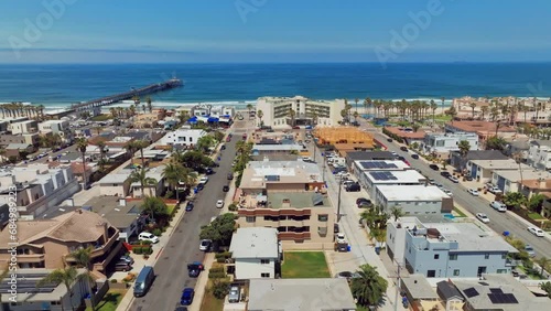 Cityscape On Shoreline Of Imperial Beach With View Of Imperial Beach Pier. San Diego County, California. aerial sideways photo