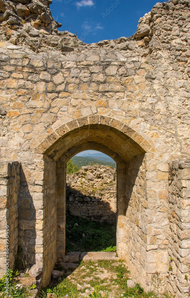 A doorway in the historic 15th century Ostrovica Castle overlooking Kulen Vakuf village in the Una National Park. Una-Sana Canton, Federation of Bosnia and Herzegovina. Early September