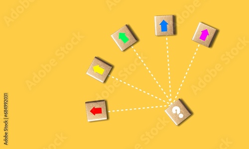 Choosing a strategy. Business decision, wood cubes with arrows