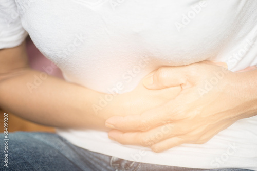 Picture of woman showing abdominal pain photo