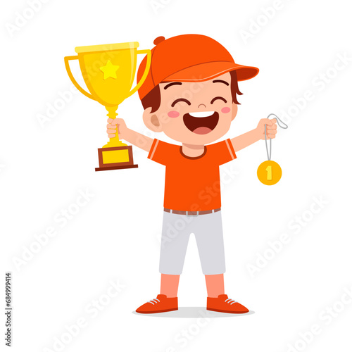 little kid holding trophy winning in sport