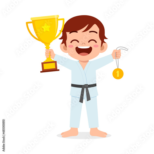 little kid holding trophy winning in sport