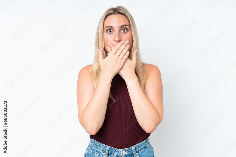 Young caucasian woman isolated on white background covering mouth with hands Young caucasian woman isolated on white background covering mouth with hands