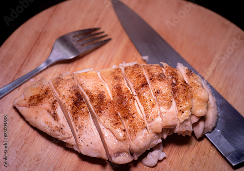 Baked chicken breast cut in...