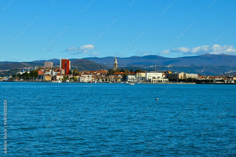 View of the town of Koper at the coast of the Adriatic sea and hill in the background
