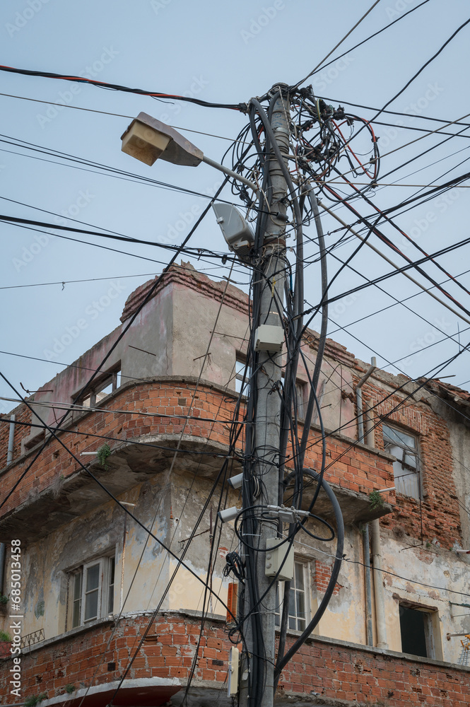 Chaotic Installation of Power and Telecommunication Cables on a Utility Pole