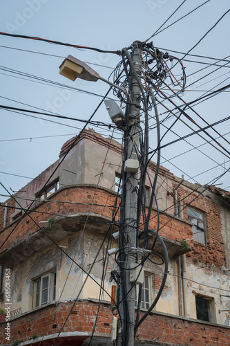Obraz na płótnie Chaotic Installation of Power and Telecommunication Cables on a Utility Pole w salonie