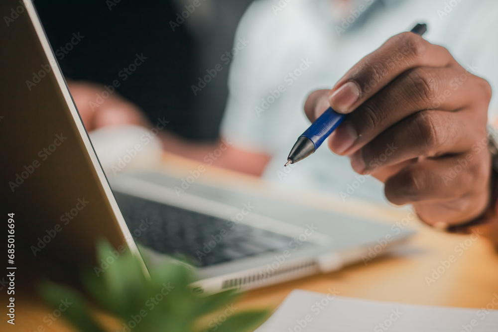 Business accounting concept, businessman using calculator with laptop computer Ready to write a summary of the organization's annual income.
Business accounting concept, businessman using calculator with laptop computer Ready to write a summary of the organization's annual income.