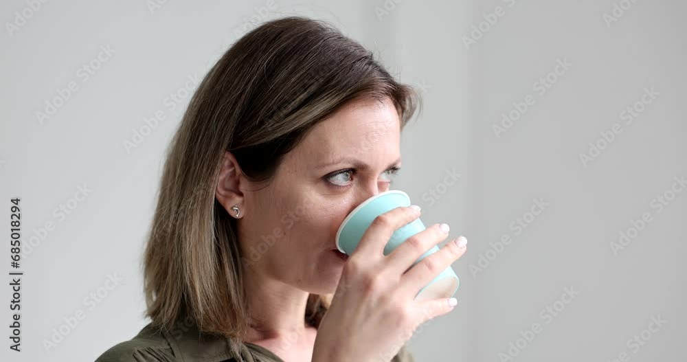 Woman drinking water from glass 4k movie slow motion. Body fluid balance concept