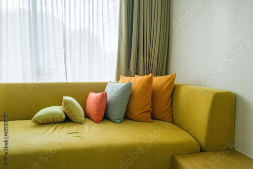 Sofa with colorful pillows on top