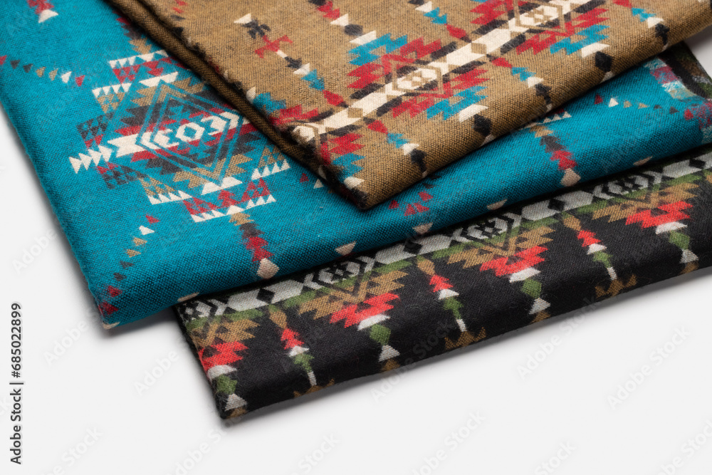Warm rugs, stoles are stacked in stack of several rows. Accessories for cold weather from natural material. Warm rugs, stoles are stacked in stack of several rows. Accessories for cold weather from natural material.