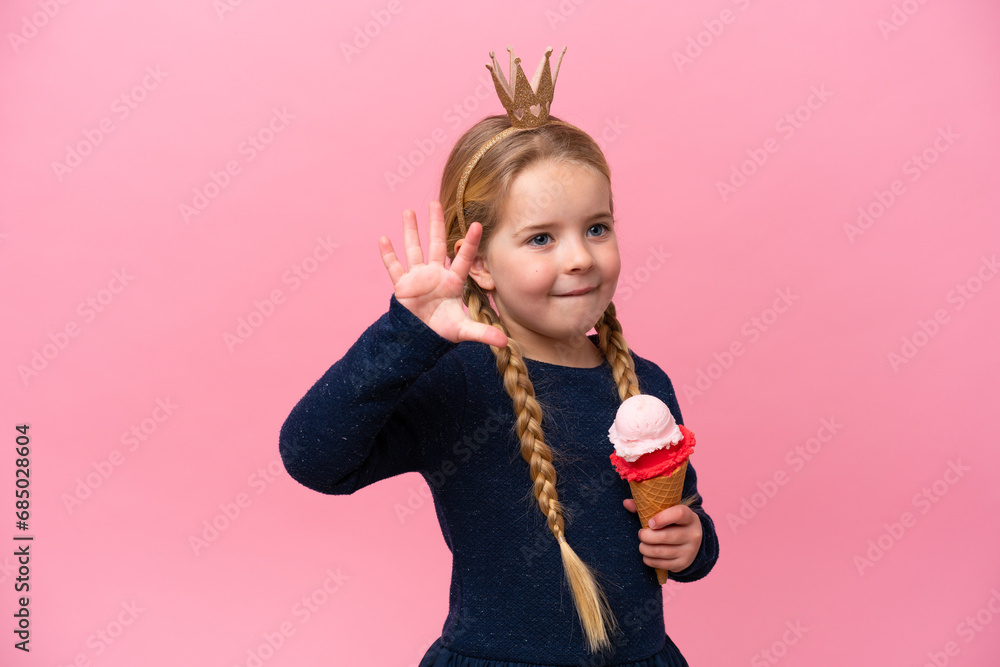 Little caucasian girl with a cornet ice cream isolated on pink background Little caucasian girl with a cornet ice cream isolated on pink background