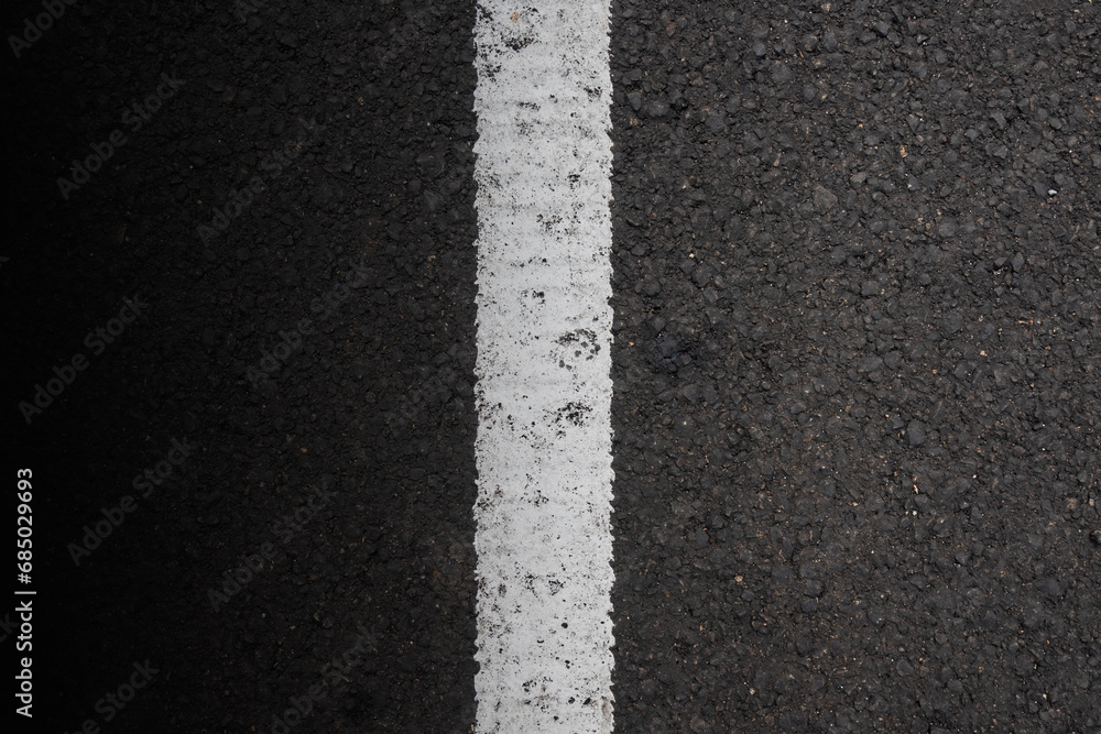 Fototapeta premium Close-up view of the black asphalt
