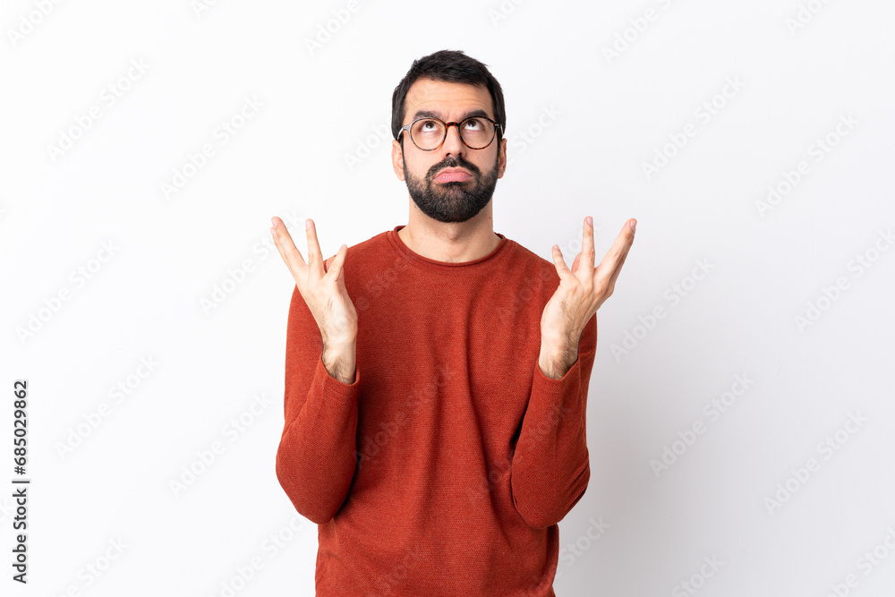 Fototapeta premium Caucasian handsome man with beard over isolated white background frustrated by a bad situation