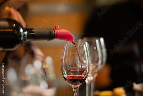 Wine glasses on a table in a restaurant, shallow depth of field