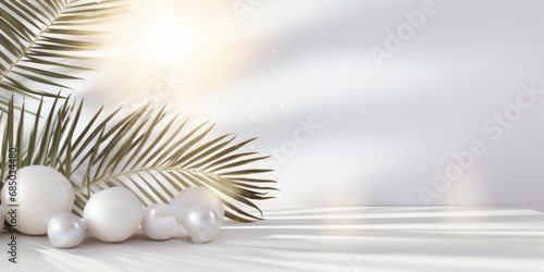 Serenity in Simplicity. A White Table Adorned with Balls and Palm Leaves