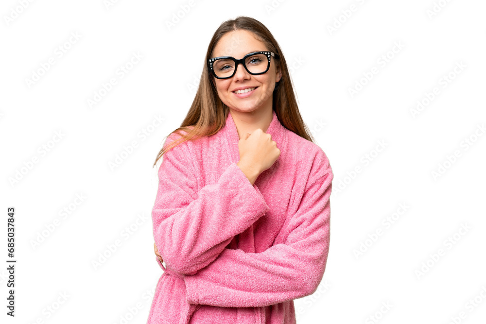 Young woman in a bathrobe over isolated chroma key background with glasses and smiling Young woman in a bathrobe over isolated chroma key background with glasses and smiling