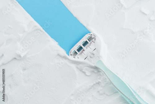 Razor glides through creamy foam, embodying the essence of a smooth, indulgent shave