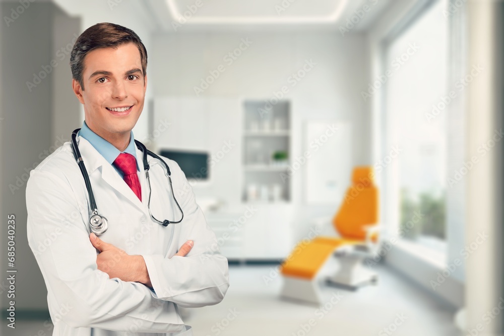 Confident smart doctor at modern hospital.