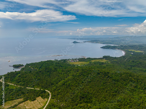 Tropical island with houses in costal area. Mindano, Philippines. photo