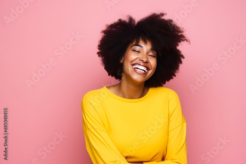 Colorful studio portrait of an african-american young woman smiling happily, yellow and pink. Generative AI