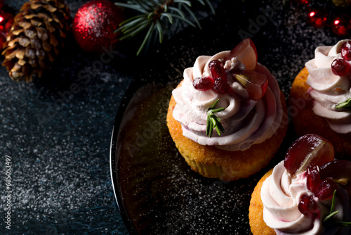Traditional Christmas cottage cheese cupcakes. Decorated with fir branches and Christmas decorations. Copy space. Low key
