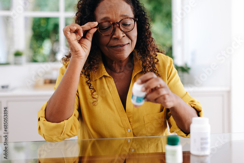 Black woman managing a chronic health condition with long-term medication photo