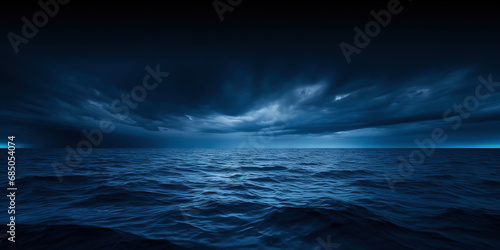 Fototapeta Dark sea surface with a dramatic cloudy sky above