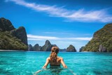 Young woman enjoying the beauty of a tropical island in Krabi, Thailand, A young woman swimming in clear sea water in a lagoon and looking at a beautiful landscape, Travelling tour, AI Generated