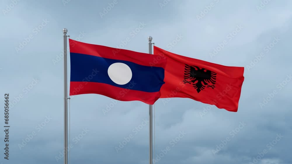 Laos flag and Albania flag waving together on cloudy sky, endless seamless loop Laos flag and Albania flag waving together on cloudy sky, endless seamless loop