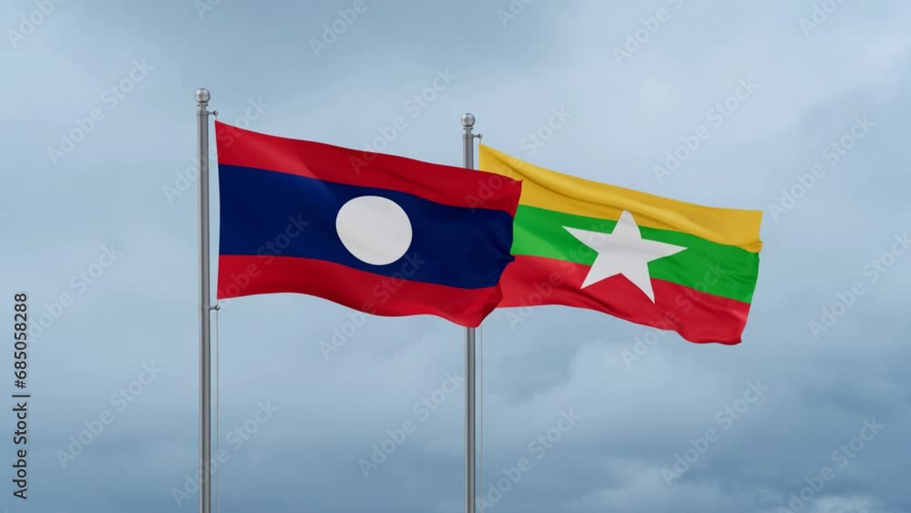 Myanmar aka Burma flag and Laos flag waving together on cloudy sky, endless seamless loop, two country relations concept Myanmar aka Burma flag and Laos flag waving together on cloudy sky, endless seamless loop, two country relations concept