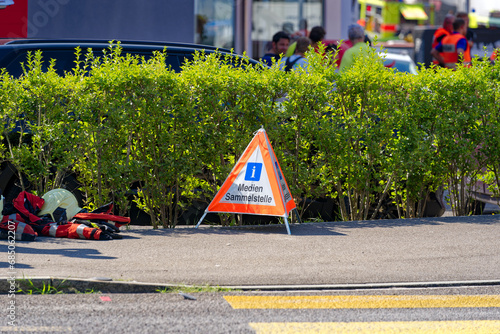 Fire and smoke at recycling collection point with mobile road sign at Swiss City of Wallisellen on a hot summer day. Photo taken July 11th, 2023, Wallisellen, Canton Zürich, Switzerland. photo