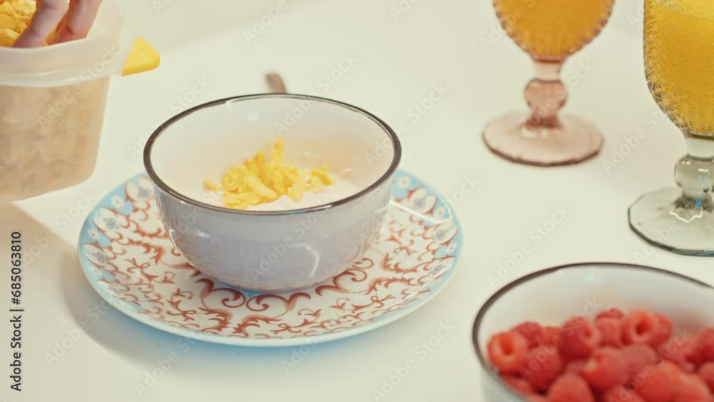 Table set with a variety of breakfast bowls with cereals and fruits Table set with a variety of breakfast bowls with cereals and fruits