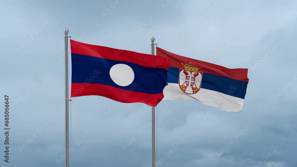 Republic of Serbia and Laos flag waving together on cloudy sky, endless seamless loop, two country cooperation concept Republic of Serbia and Laos flag waving together on cloudy sky, endless seamless loop, two country cooperation concept