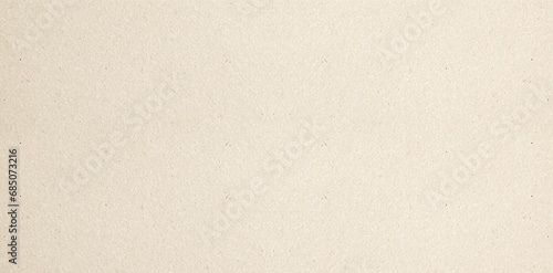 Pastel brown craft paper texture background or cardboard surface for design