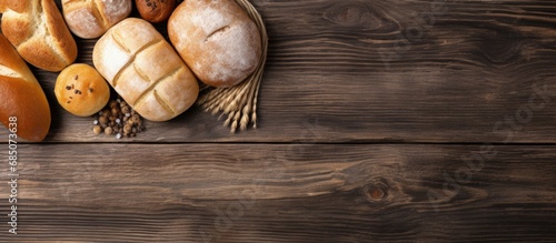 Freshly baked bread on a wooden table with a variety of bakery goods copy space image