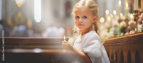 Girl being christened in church ceremony copy space image