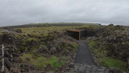 DOLLY SHOT - Raufarhólshellir lava tunnel entrance. Raufarhólshellir is a lava tube formed during the Leitahraun eruption and is one of Iceland's longest caves. photo